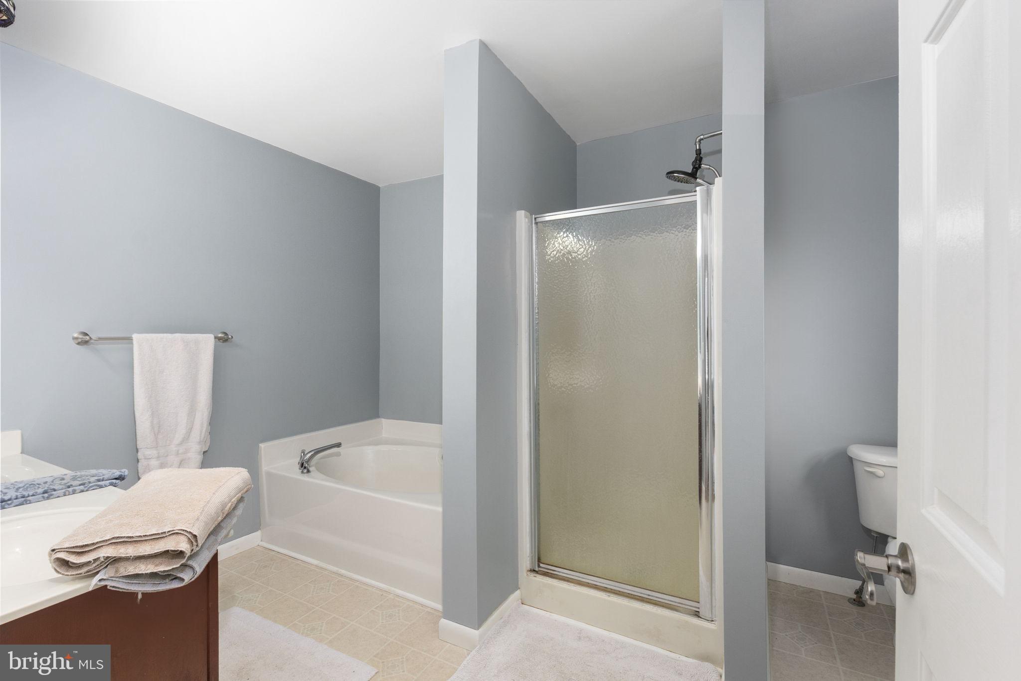 8314 Myrtle Lane King George, VA 22485 - Photo 18 of 40 a white bath tub sitting next to a white toilet