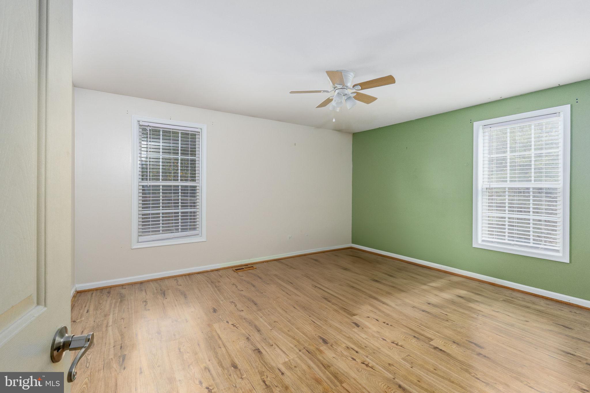 8314 Myrtle Lane King George, VA 22485 - Photo 24 of 40 wooden floor in an empty room with a window