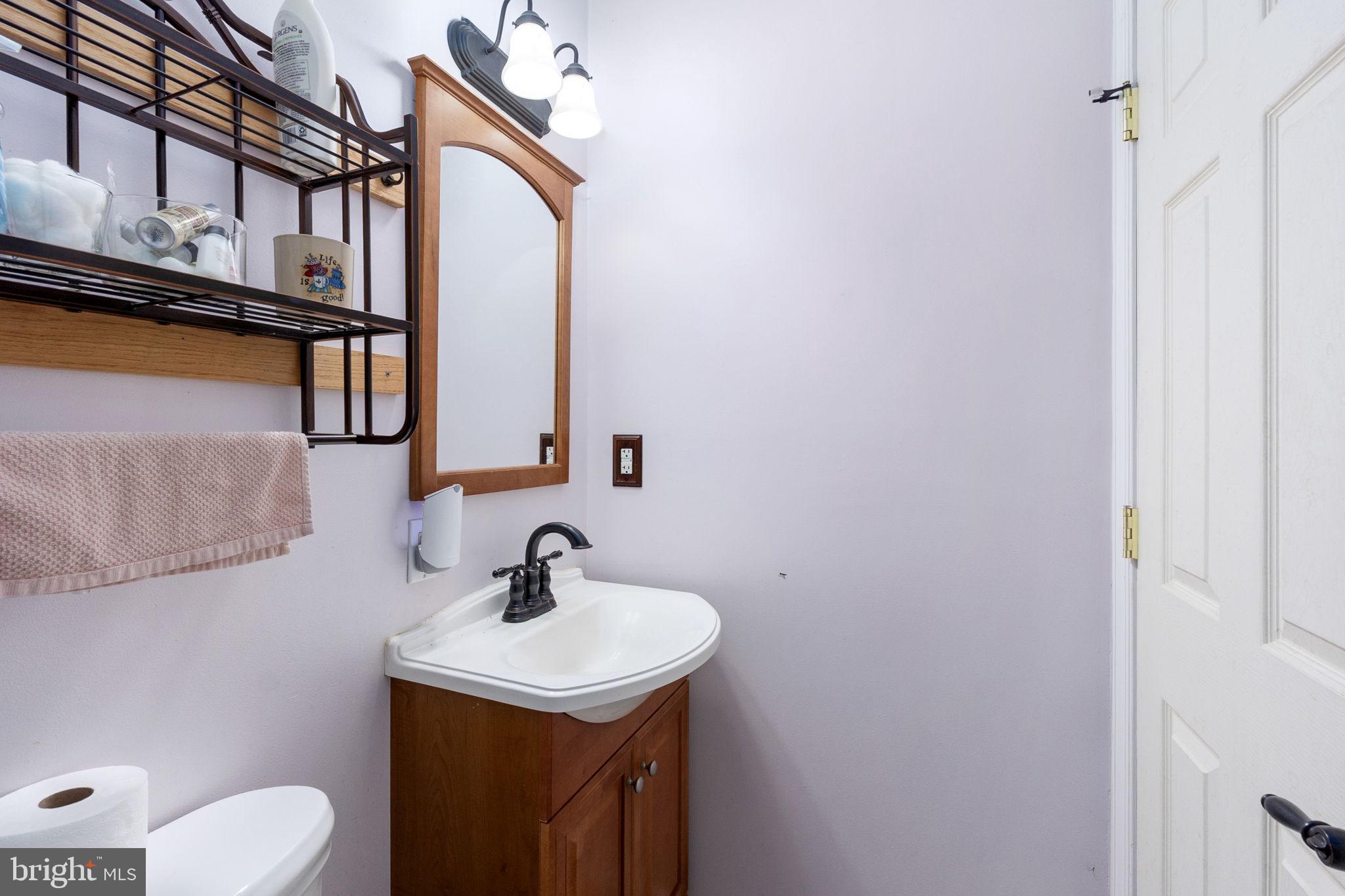 8314 Myrtle Lane King George, VA 22485 - Photo 30 of 40 a bathroom with a sink a toilet and shower