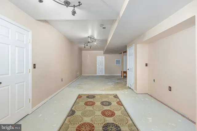 a spacious bedroom with a bed and a table