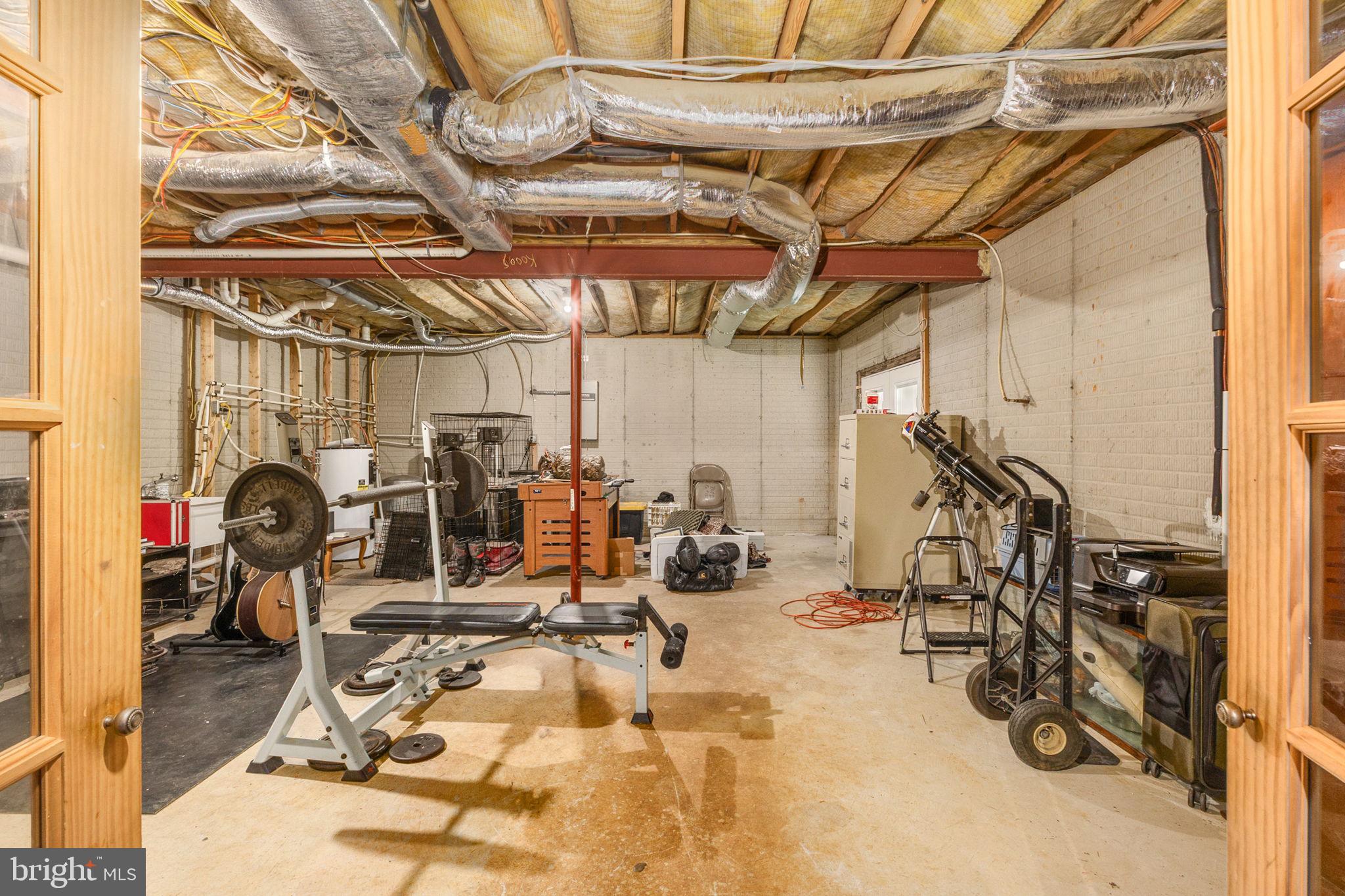 8314 Myrtle Lane King George, VA 22485 - Photo 39 of 40 a view of a room with gym equipment