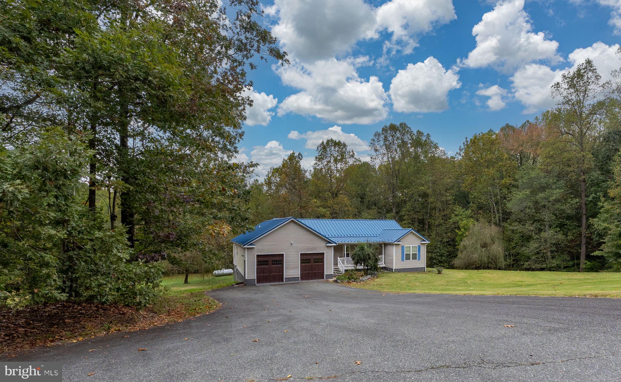 8314 Myrtle Lane King George, VA 22485 - Photo 5 of 40 a view of a house with a yard and large trees