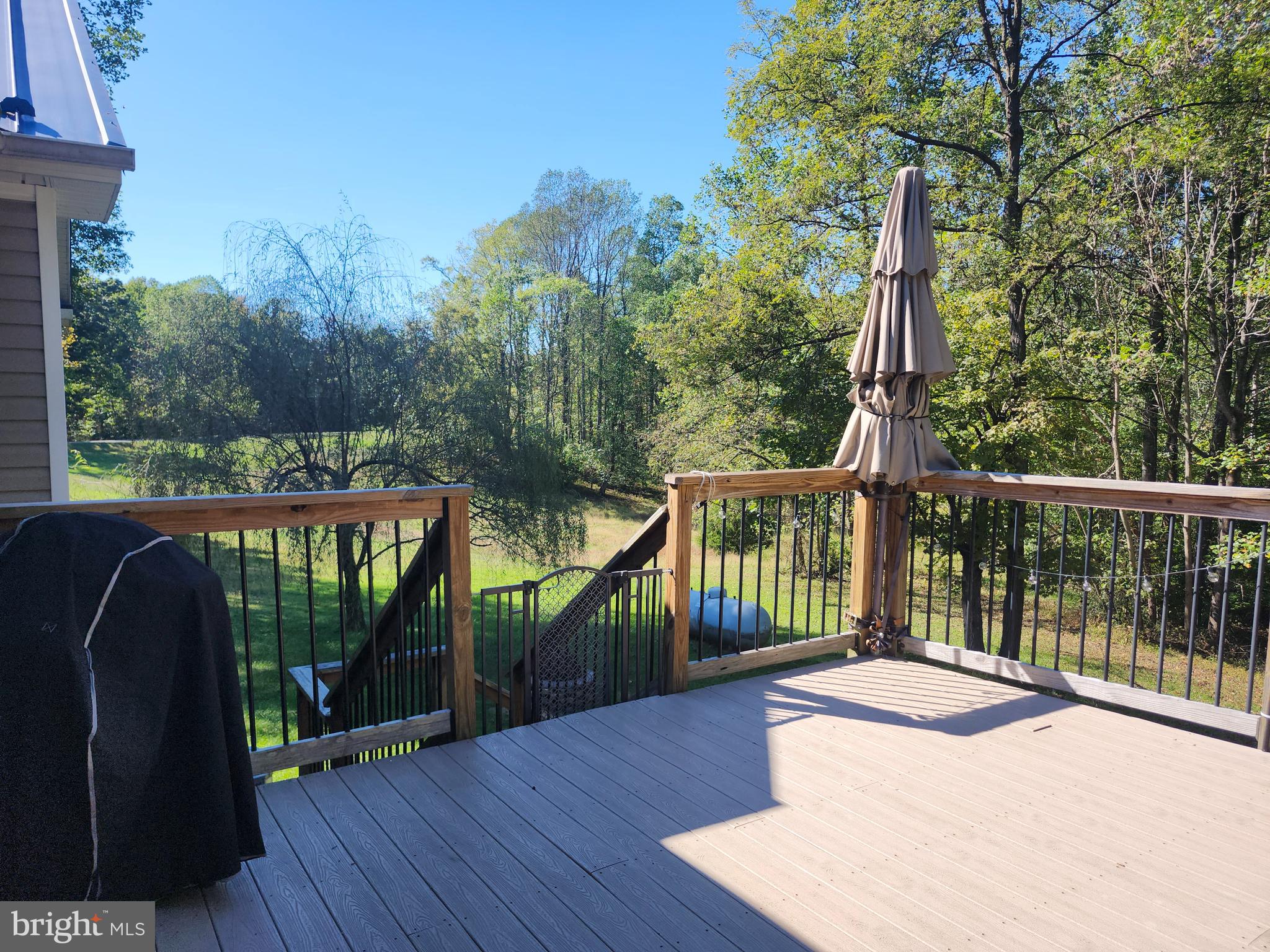 8314 Myrtle Lane King George, VA 22485 - Photo 8 of 40 a balcony with wooden floor and outdoor space