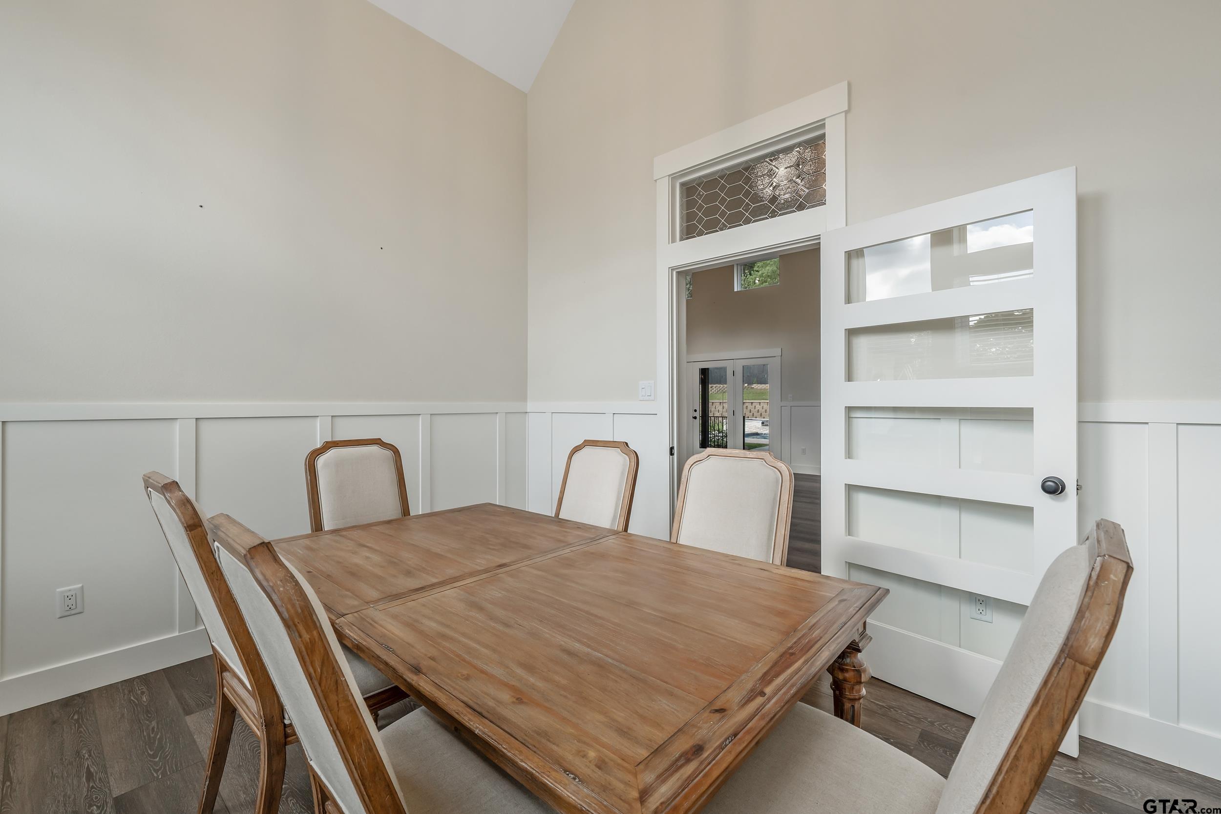 16919 Sawyer Way Lindale, TX 75771 - Photo 13 of 43 a dining room with a wooden table and chairs
