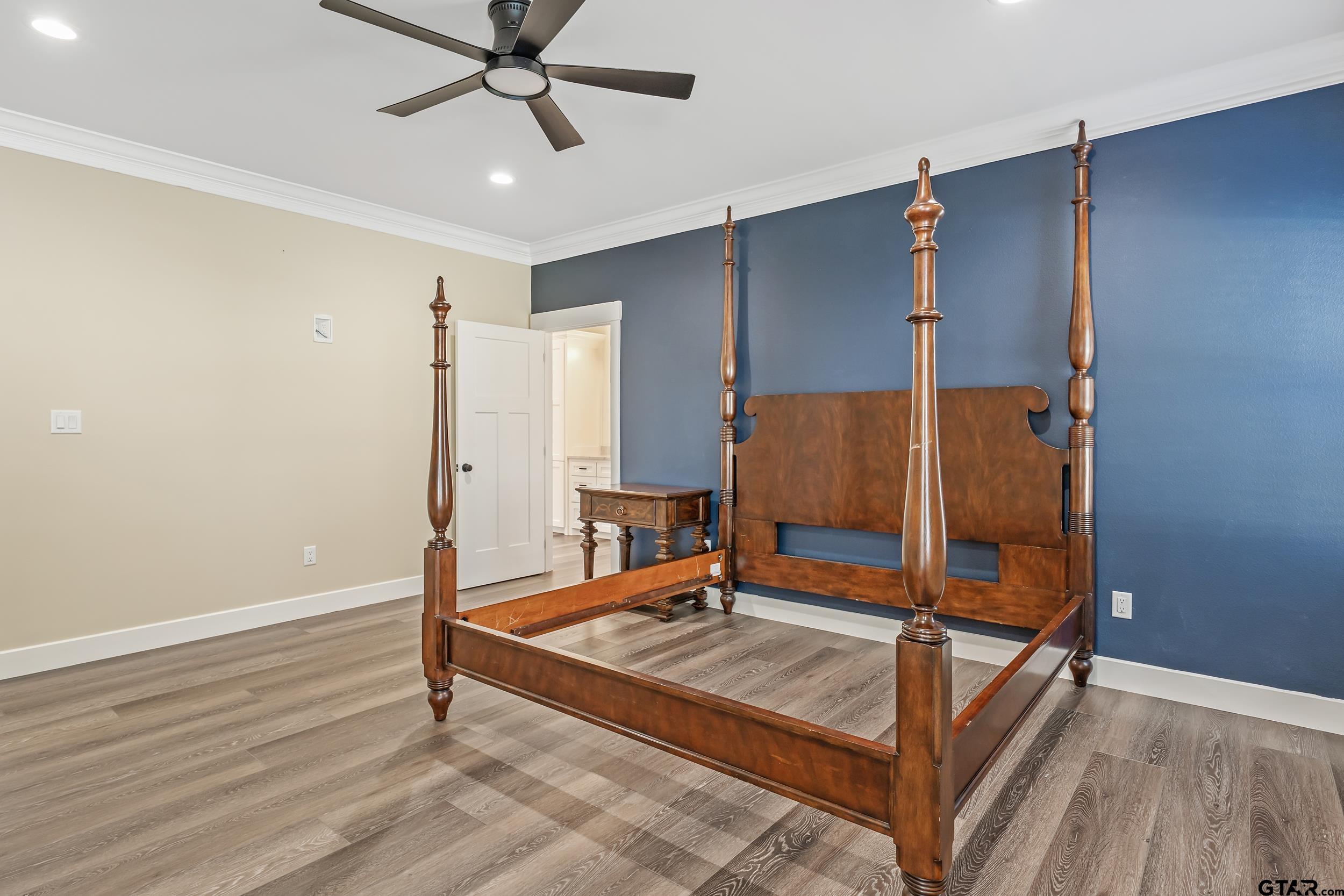 16919 Sawyer Way Lindale, TX 75771 - Photo 15 of 43 a living room with a bed furniture and a ceiling fan