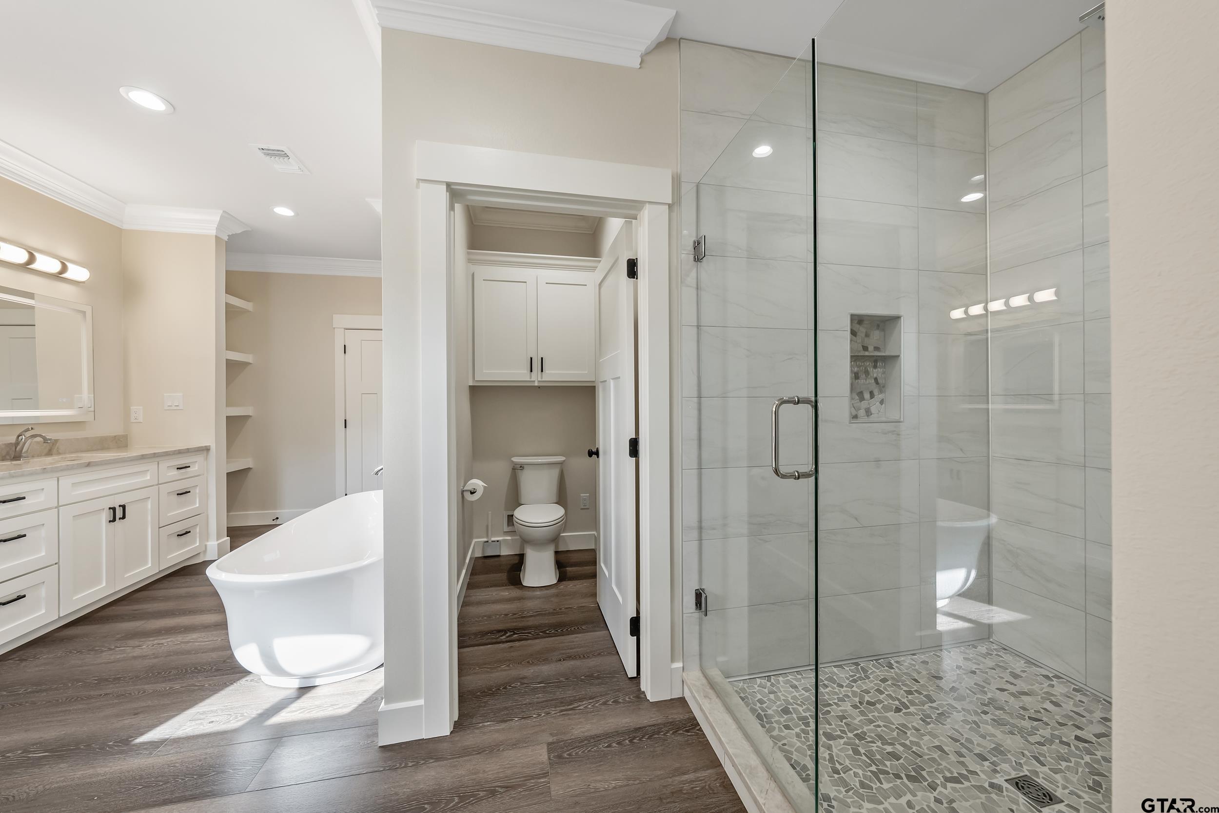 16919 Sawyer Way Lindale, TX 75771 - Photo 17 of 43 a bathroom with a shower and a mirror