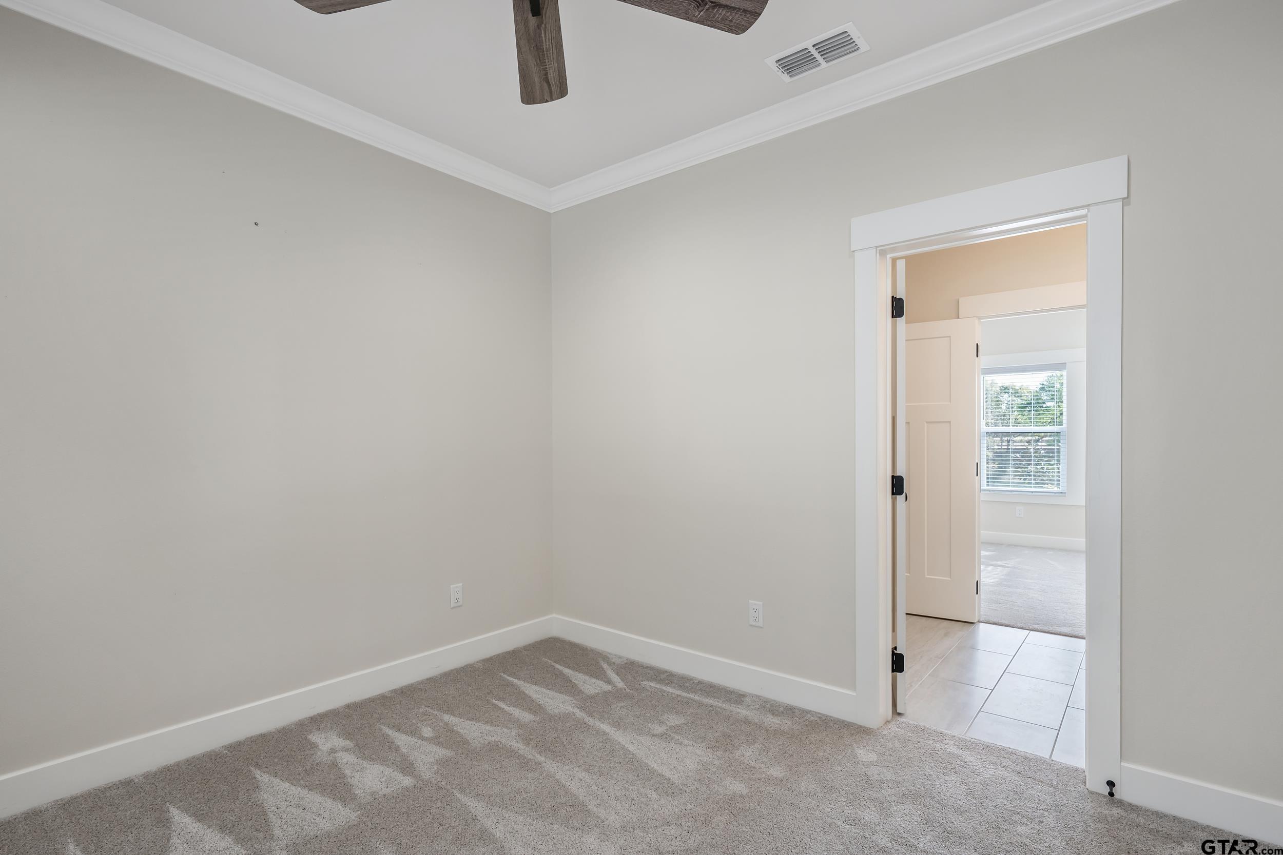 16919 Sawyer Way Lindale, TX 75771 - Photo 20 of 43 an empty room with a empty space and window