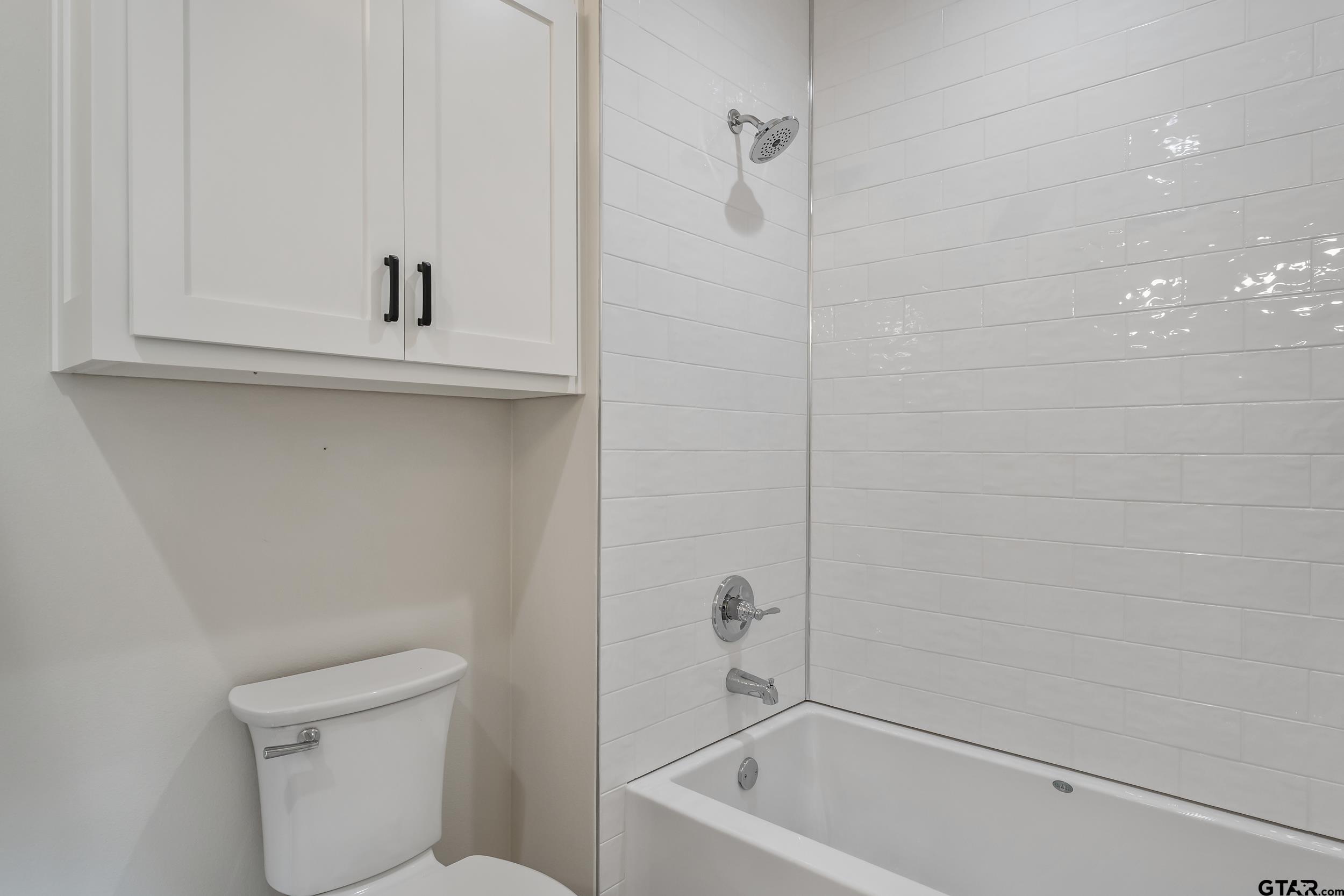 16919 Sawyer Way Lindale, TX 75771 - Photo 24 of 43 a bathroom with a sink a toilet and a bathtub