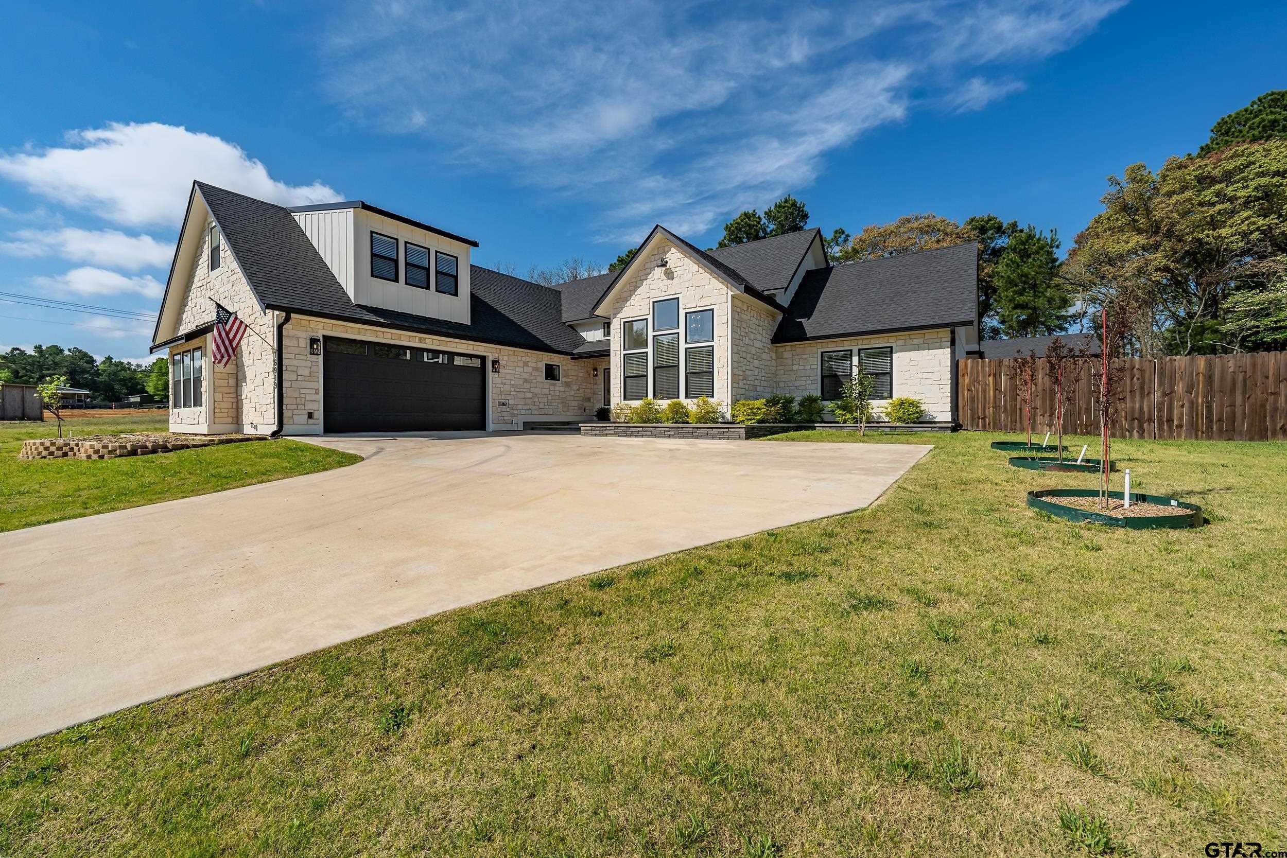16919 Sawyer Way Lindale, TX 75771 - Photo 42 of 43 a front view of a house with a yard