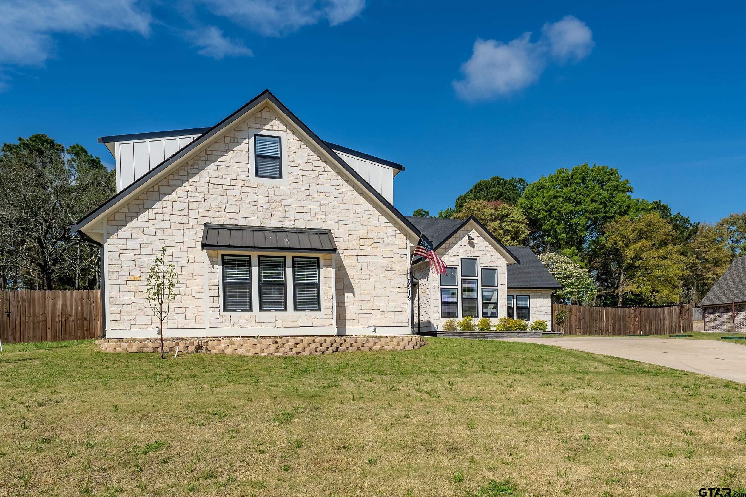16919 Sawyer Way Lindale, TX 75771 - Photo 43 of 43 a front view of a house with a garden