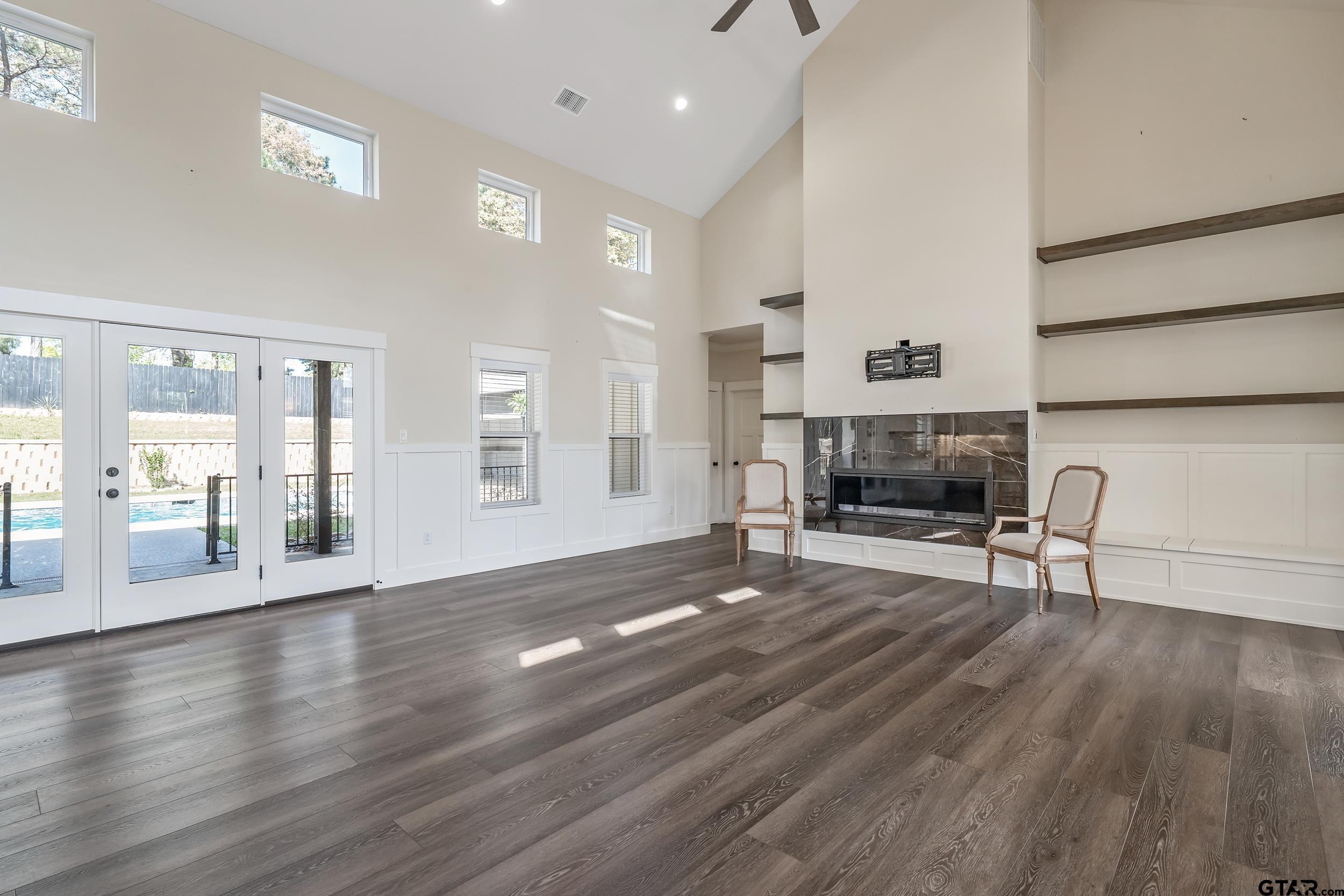 16919 Sawyer Way Lindale, TX 75771 - Photo 7 of 43 a view of a livingroom with fireplace and wooden floor
