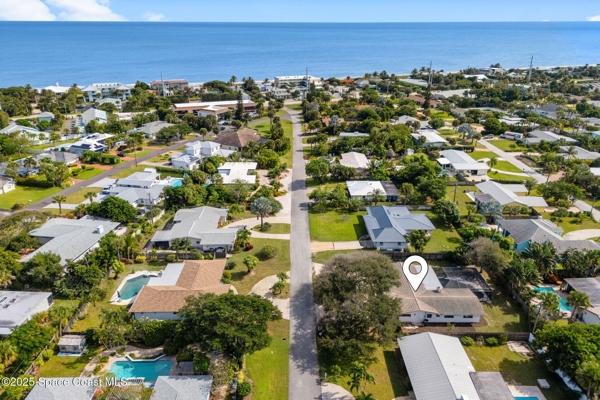 an aerial view of residential houses with outdoor space