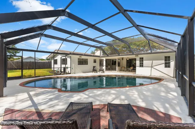 a view of a house with a swimming pool