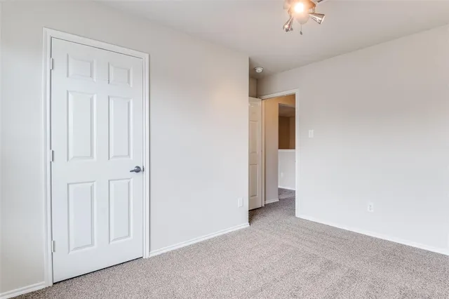 an empty room with a bathroom