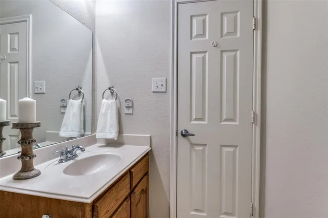 a bathroom with sinks and a mirror