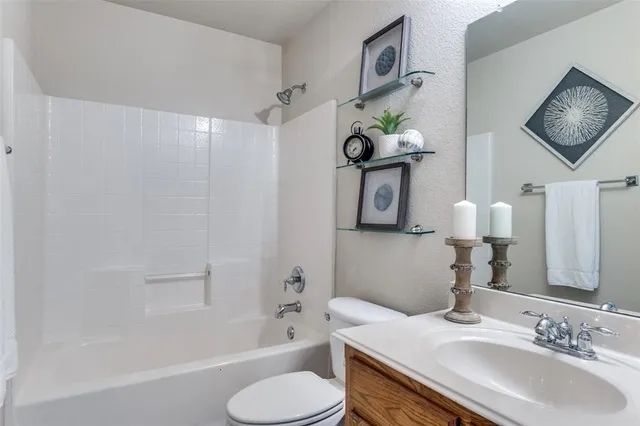 a bathroom with a sink toilet and bathtub