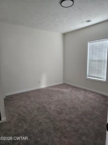 a view of a room with a window