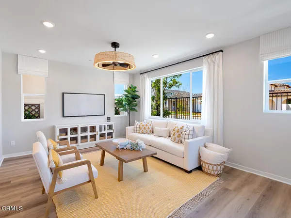a living room with furniture and a large window