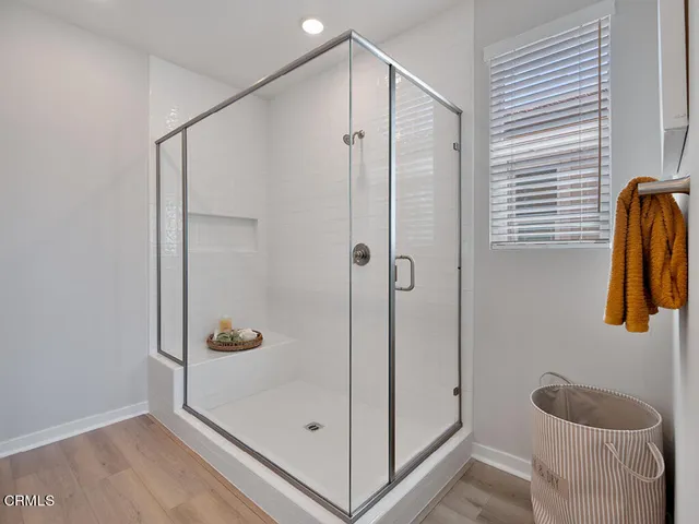 a bathroom with a shower and a toilet