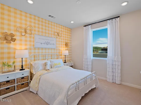 a bedroom with a bed and a cabinets