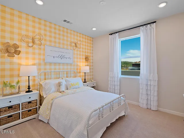 a bedroom with a bed and a cabinets