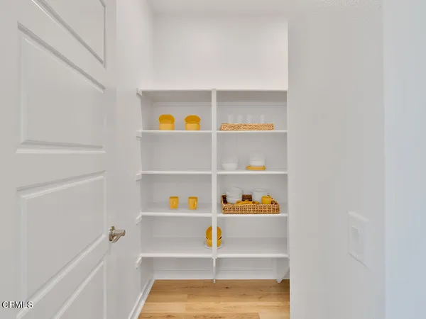 a view of small living room with shelves