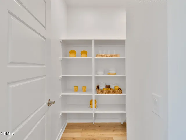 a view of small living room with shelves