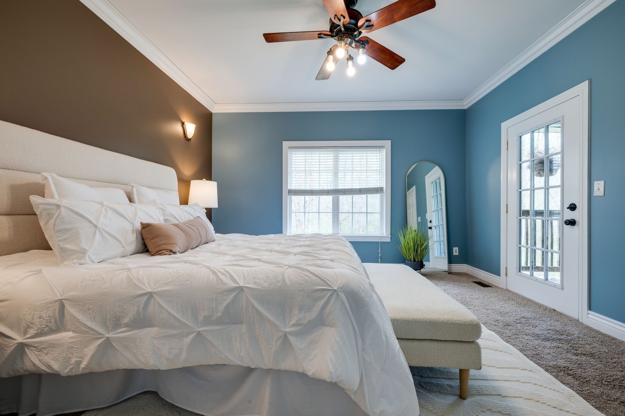 264 Fire Tower Road Dickson, TN 37055 - Photo 21 of 46 a bedroom with a large bed and a chandelier