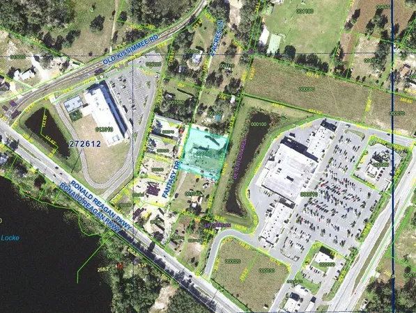 an aerial view of a swimming pool with outdoor space