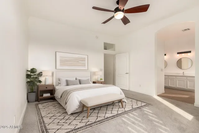 a bedroom with a bed and window