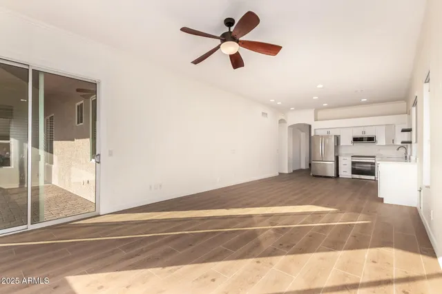 a view of kitchen with furniture and a ceiling fan