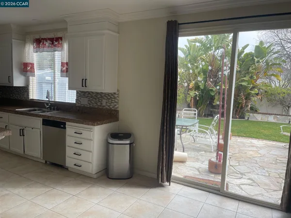 a kitchen with stainless steel appliances granite countertop a stove and a refrigerator