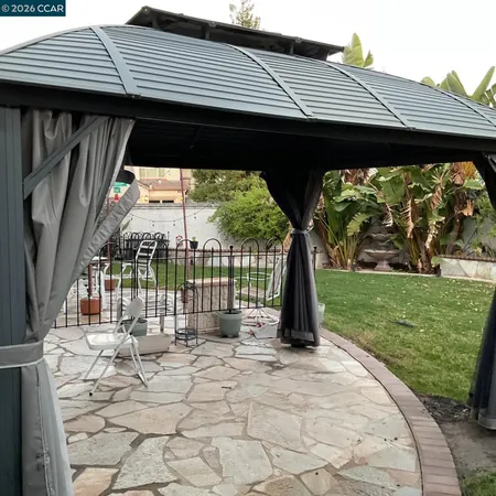 a backyard of a house with lots of green space