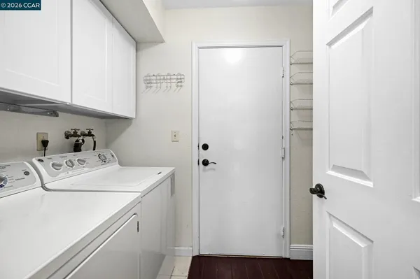 a utility room with dryer and washer