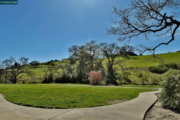 an aerial view of residential house with outdoor space and swimming pool