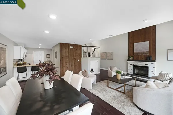 a living room with fireplace furniture and a flat screen tv