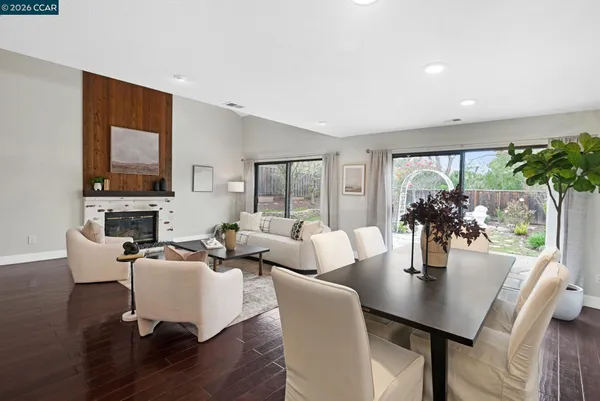 a living room with fireplace furniture and a flat screen tv