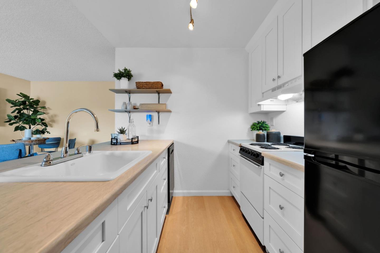244 Stonegate Circle San Jose, CA 95110 - Photo 12 of 38 a kitchen with granite countertop a sink stainless steel appliances and cabinets