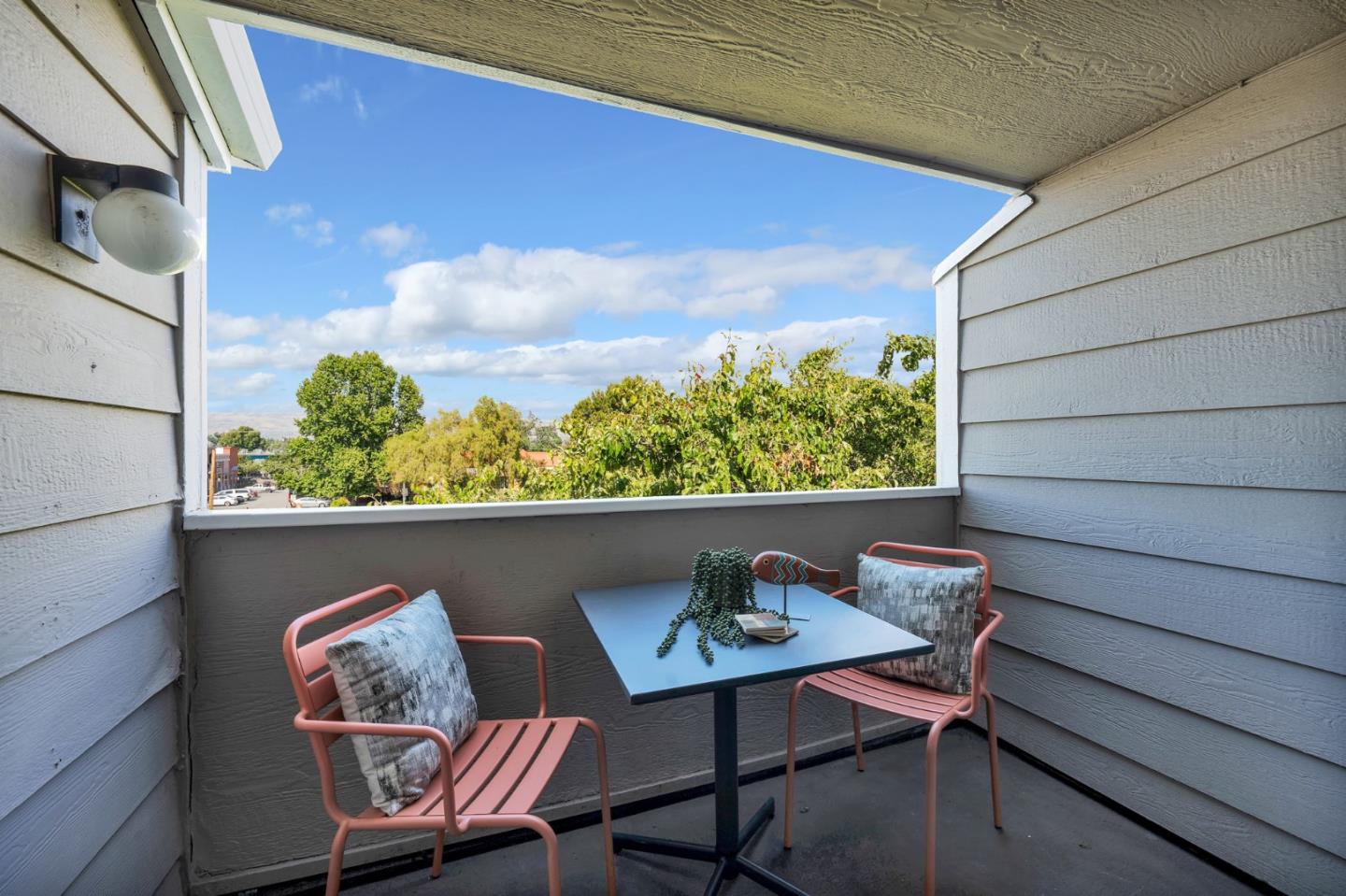 244 Stonegate Circle San Jose, CA 95110 - Photo 15 of 38 a balcony with table and chairs