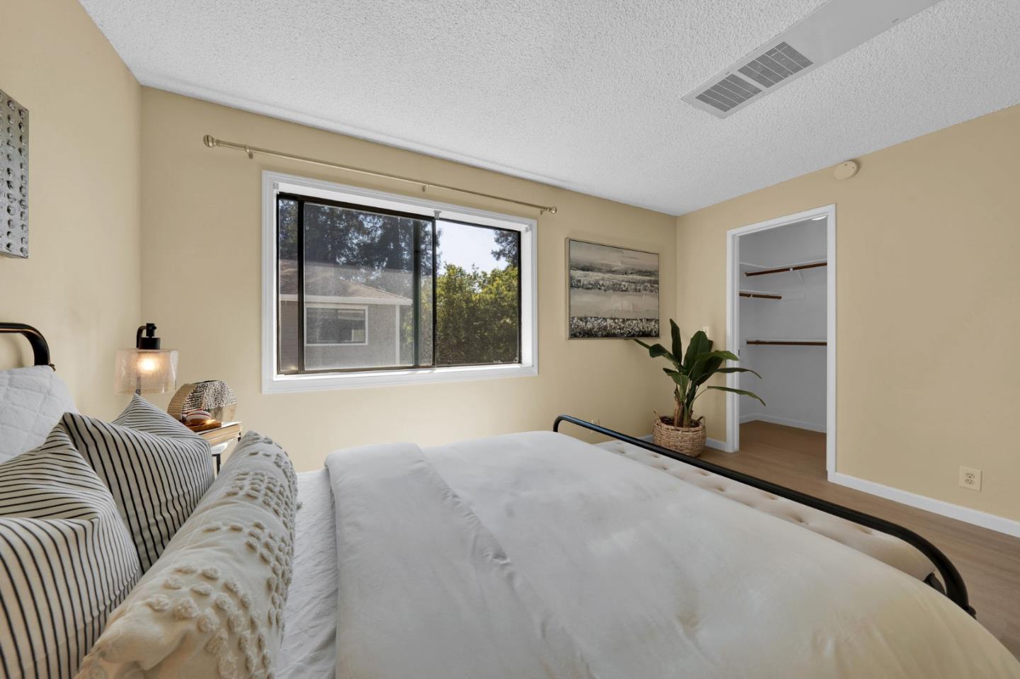 244 Stonegate Circle San Jose, CA 95110 - Photo 20 of 38 a bedroom with a large bed and a window