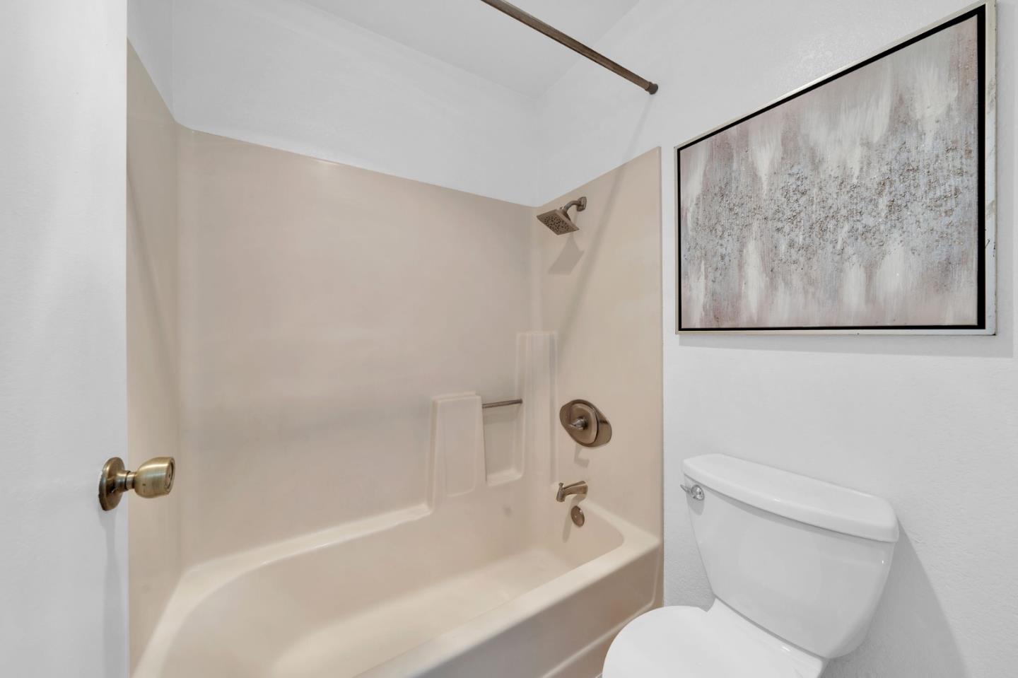 244 Stonegate Circle San Jose, CA 95110 - Photo 23 of 38 a bathroom with a bathtub and shower