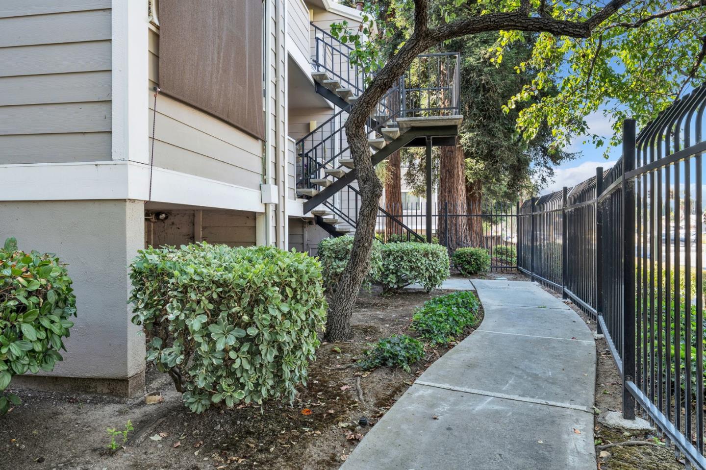 244 Stonegate Circle San Jose, CA 95110 - Photo 25 of 38 a front view of a house with garden