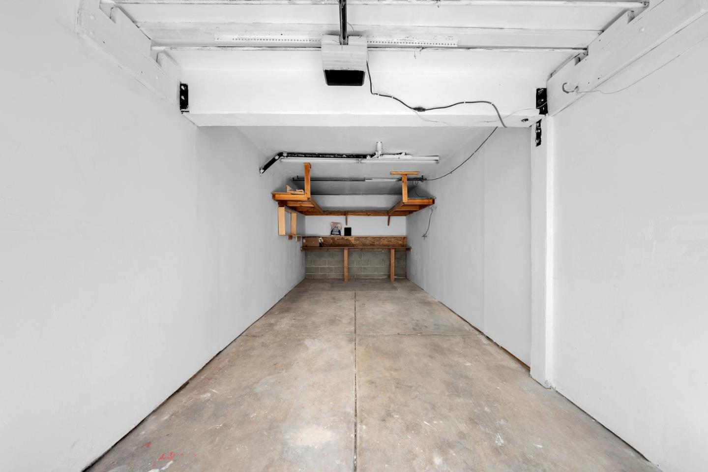 244 Stonegate Circle San Jose, CA 95110 - Photo 26 of 38 a view of storage and utility room with racks on the wall