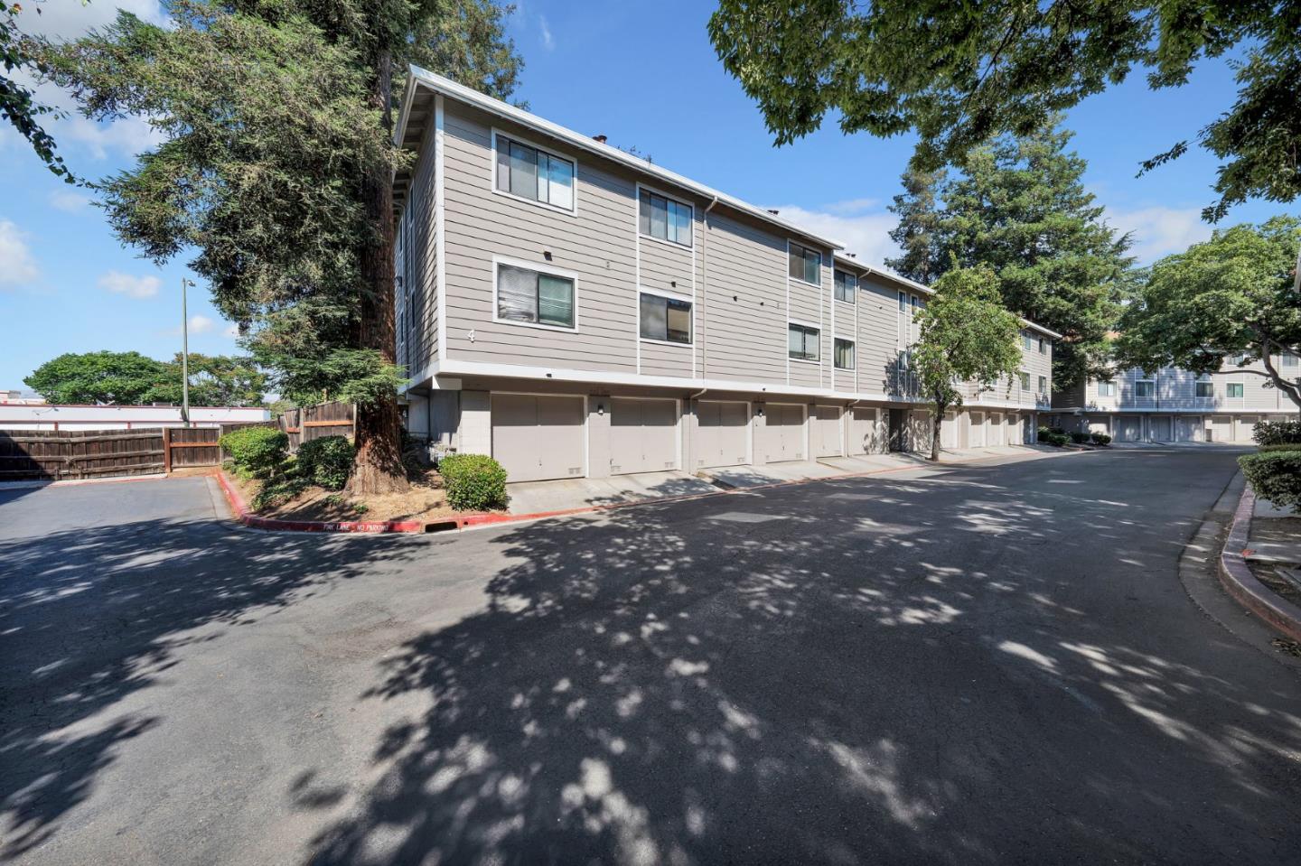 244 Stonegate Circle San Jose, CA 95110 - Photo 29 of 38 a view of a white house with a yard