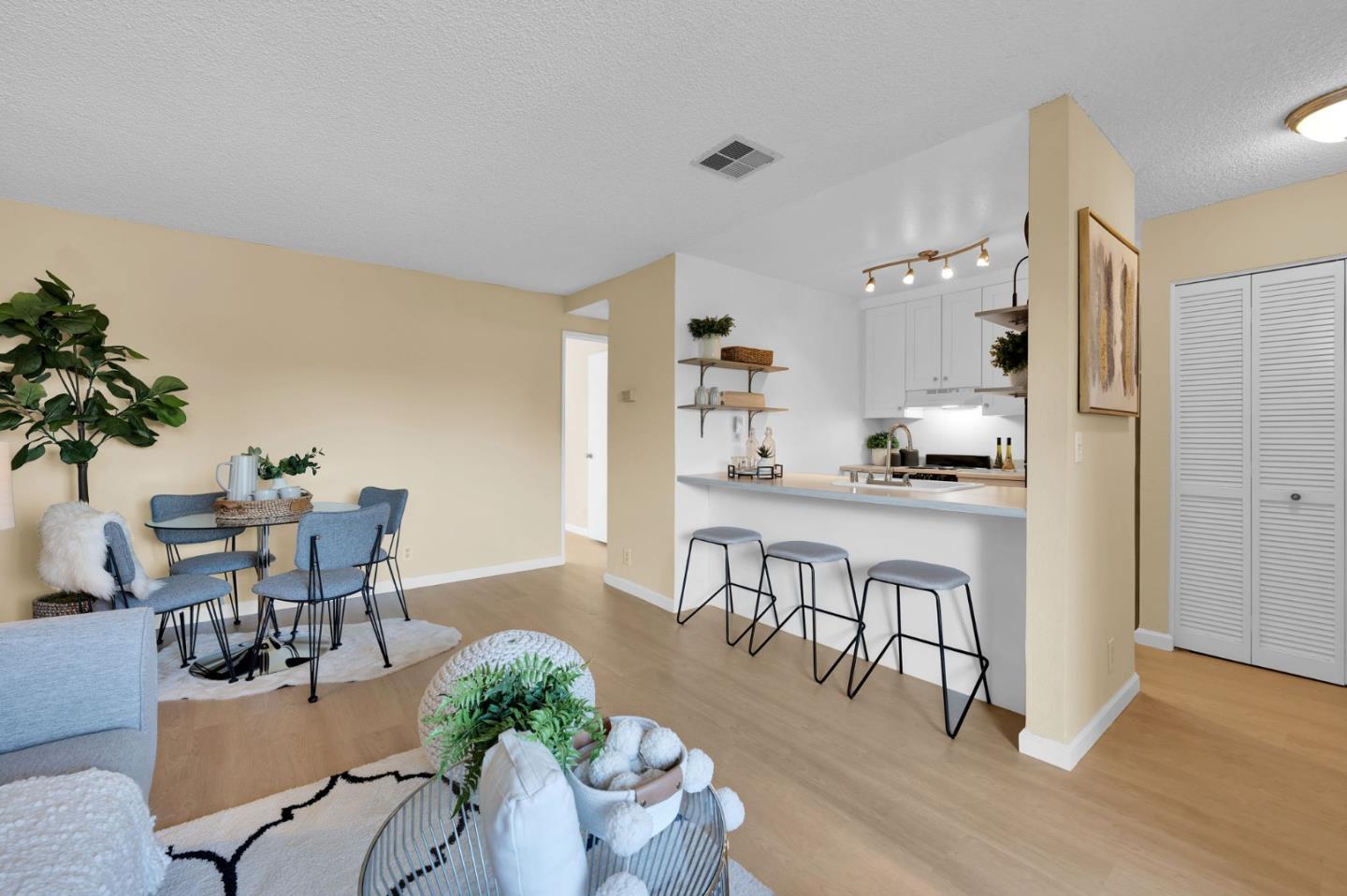 244 Stonegate Circle San Jose, CA 95110 - Photo 5 of 38 a dinning room with kitchen island stainless steel appliances furniture a dining table and chairs