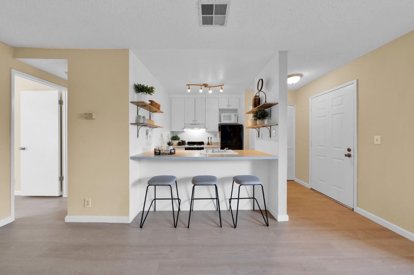 244 Stonegate Circle San Jose, CA 95110 - Photo 10 of 38 a view of kitchen with furniture and wooden floor