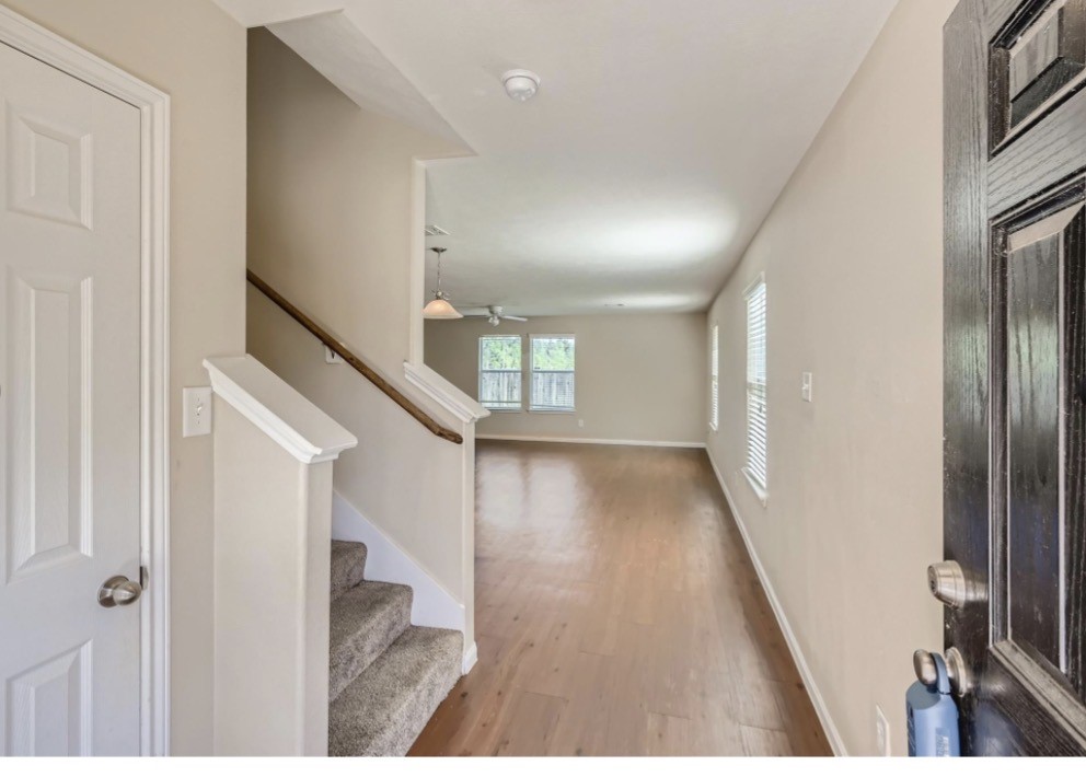 1111 Watson Crossing Way Houston, TX 77067 - Photo 4 of 8 a view of an entryway with wooden floor