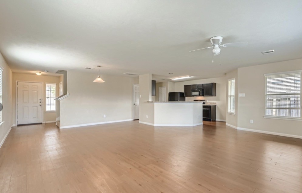 1111 Watson Crossing Way Houston, TX 77067 - Photo 6 of 8 a view of a kitchen with a sink and a stove top oven