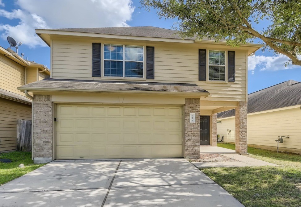1111 Watson Crossing Way Houston, TX 77067 - Photo 7 of 8 a view of a house with a backyard