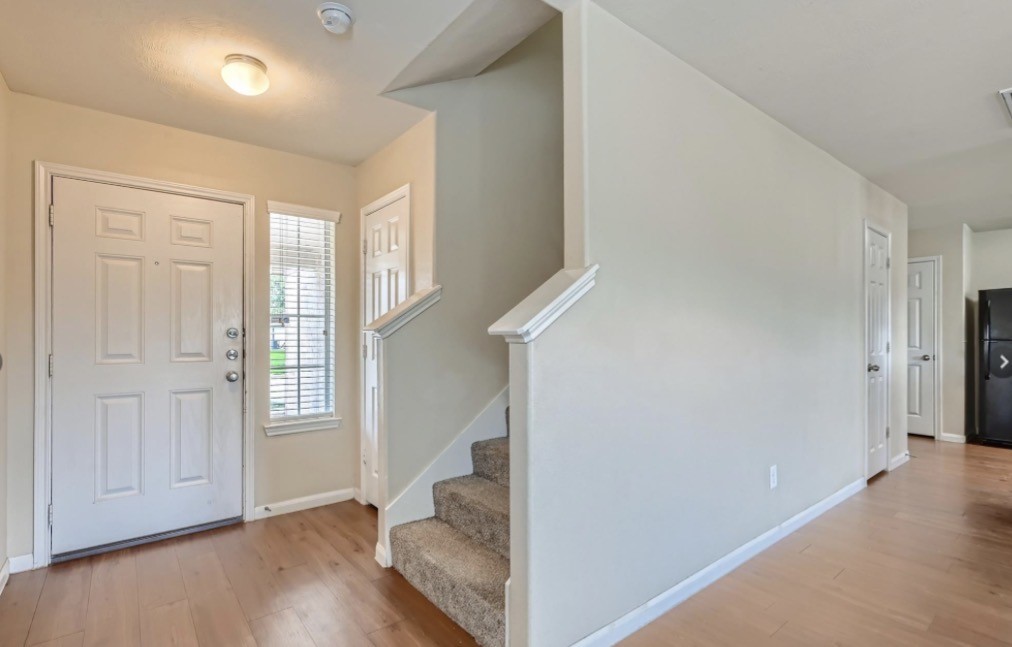 1111 Watson Crossing Way Houston, TX 77067 - Photo 8 of 8 a view of livingroom with furniture and wooden floor